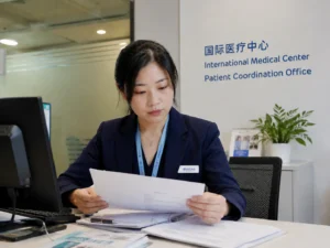 Coordinator at Chinese hospital Patient Coordination Office reviewing medical documents —international patient support China