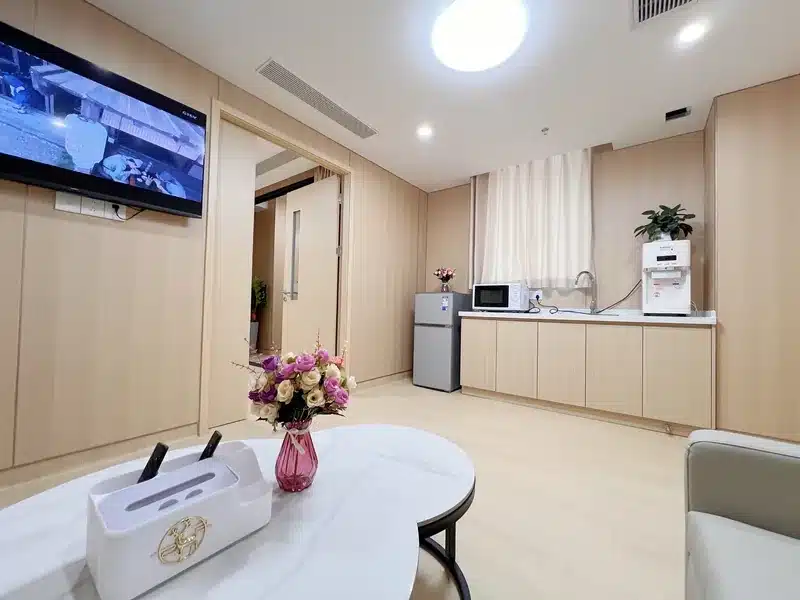 Fosun Chancheng IMC standard suite living area with fridge, microwave and water purifier &mdash; private hospital Guangzhou